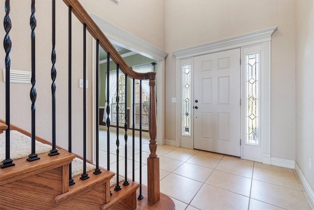 4204 Warbal Trl, Rogers, AR 72758 - entrance foyer with stairway, tile patterned flooring, plenty of natural light, baseboards, and a towering ceiling
