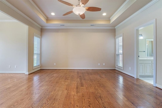 4204 Warbal Trl, Rogers, AR 72758 - unfurnished room with light wood finished floors, a raised ceiling, ceiling fan, crown molding, and baseboards