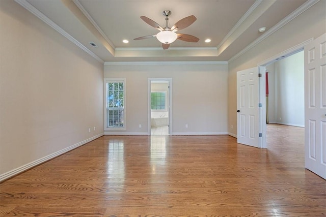 4204 Warbal Trl, Rogers, AR 72758 - unfurnished room with a raised ceiling, a ceiling fan, wood finished floors, ornamental molding, and baseboards