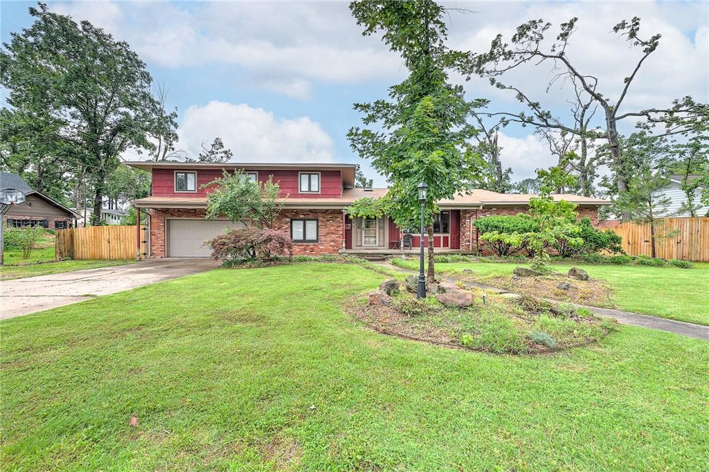1414 W Dogwood St, Rogers, AR 72758 - traditional-style house with a garage, concrete driveway, and brick siding