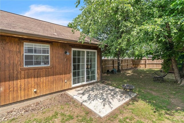 20640 Hillcrest Dr, Springdale, AR 72764 - fenced backyard with a patio area and an outdoor fire pit