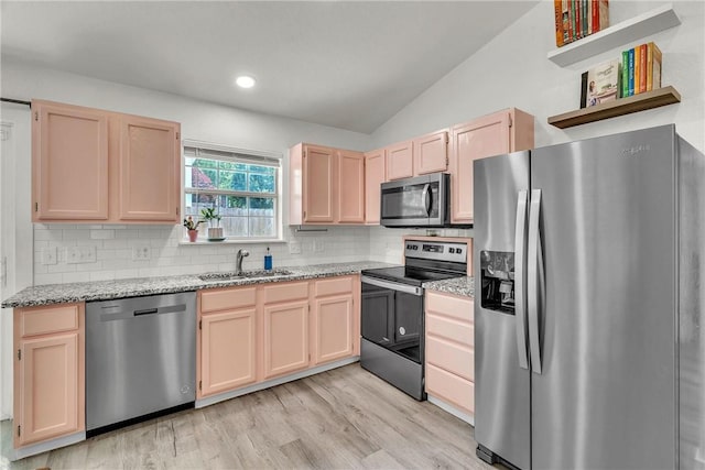 20640 Hillcrest Dr, Springdale, AR 72764 - kitchen featuring appliances with stainless steel finishes, a sink, light brown cabinets, tasteful backsplash, and lofted ceiling