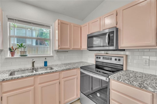 20640 Hillcrest Dr, Springdale, AR 72764 - kitchen with appliances with stainless steel finishes, a sink, decorative backsplash, light stone countertops, and vaulted ceiling
