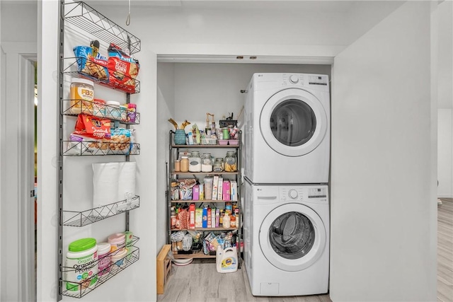 20640 Hillcrest Dr, Springdale, AR 72764 - laundry room featuring stacked washer and clothes dryer and wood finished floors