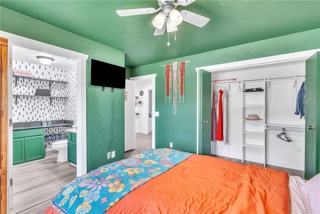 20640 Hillcrest Dr, Springdale, AR 72764 - bedroom featuring a closet, wood finished floors, a ceiling fan, and ensuite bathroom