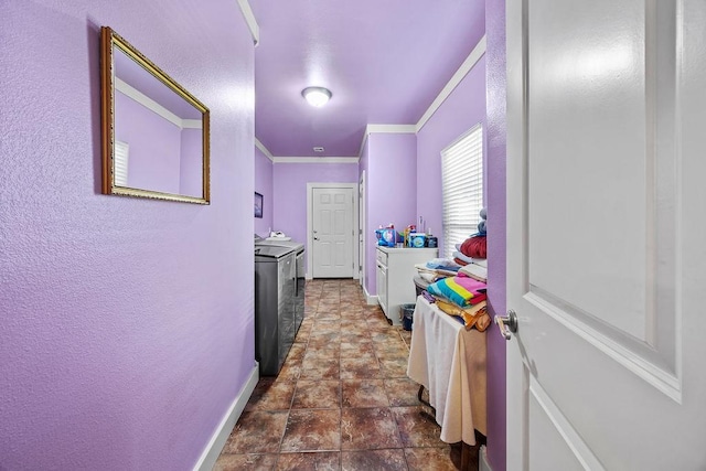 815 James Pl, West Fork, AR 72774 - corridor with washing machine and dryer, crown molding, baseboards, a textured wall, and dark stone finish floors