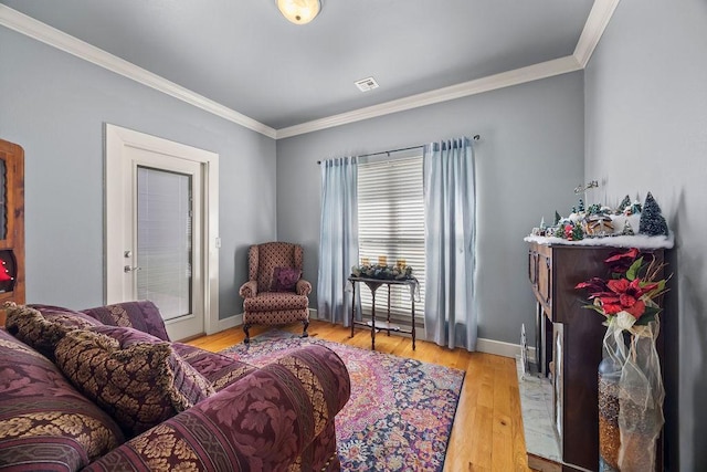 815 James Pl, West Fork, AR 72774 - living room featuring crown molding, light wood-style flooring, and baseboards