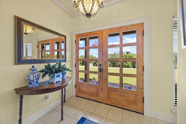 815 James Pl, West Fork, AR 72774 - entrance foyer featuring crown molding, french doors, baseboards, tile patterned flooring, and a chandelier