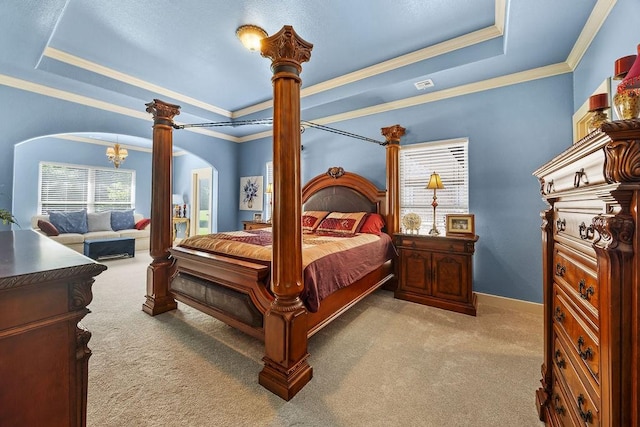815 James Pl, West Fork, AR 72774 - bedroom featuring arched walkways, carpet floors, a raised ceiling, ornamental molding, and decorative columns