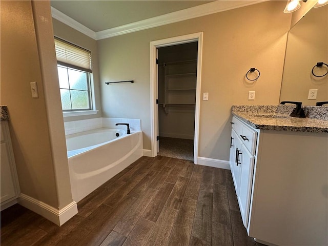 400 Fox Cir, Pea Ridge, AR 72751 - full bathroom with vanity, wood finished floors, ornamental molding, a bath, and baseboards