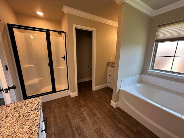 400 Fox Cir, Pea Ridge, AR 72751 - full bath with a stall shower, wood finished floors, a garden tub, crown molding, and baseboards