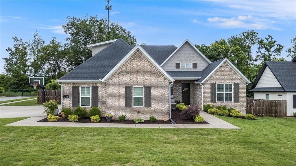 265 Waterfall Ln, Springdale, AR 72762 - view of front of house with brick siding and roof with shingles