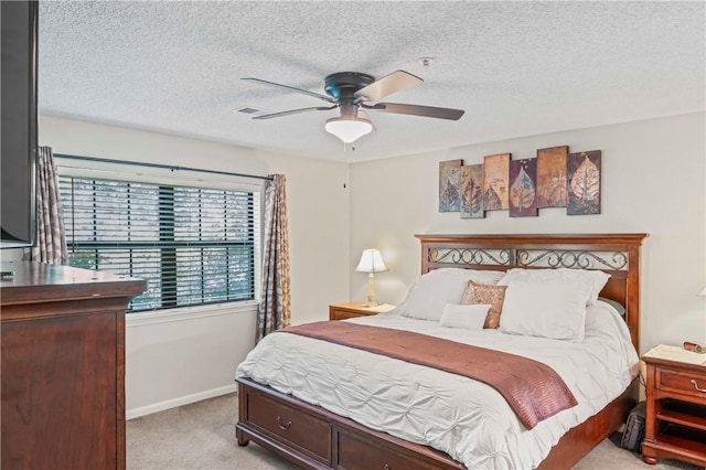 350 S Wildwood Dr Unit C15, Branson, MO 65616 - bedroom featuring light carpet, baseboards, a textured ceiling, and ceiling fan