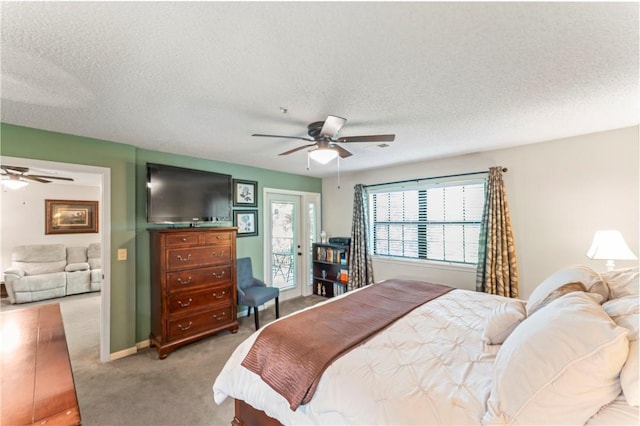 350 S Wildwood Dr Unit C15, Branson, MO 65616 - carpeted bedroom featuring access to exterior, a ceiling fan, and a textured ceiling