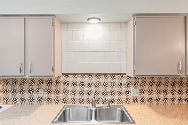 350 S Wildwood Dr Unit C15, Branson, MO 65616 - kitchen with a sink, light countertops, decorative backsplash, and gray cabinets