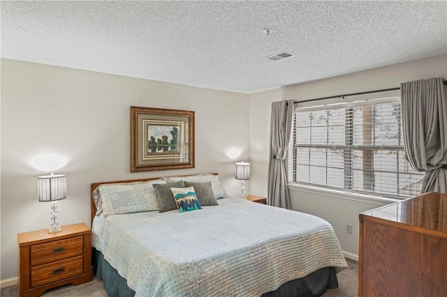 350 S Wildwood Dr Unit C15, Branson, MO 65616 - carpeted bedroom featuring a textured ceiling and baseboards