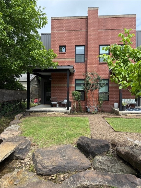 808 S Locust Ave, Fayetteville, AR 72701 - back of house featuring brick siding
