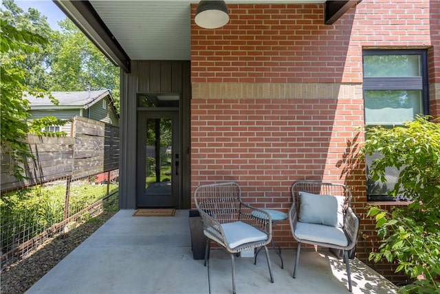 808 S Locust Ave, Fayetteville, AR 72701 - property entrance featuring brick siding and a patio area
