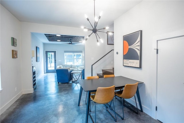808 S Locust Ave, Fayetteville, AR 72701 - dining space with stairway, a chandelier, and concrete flooring
