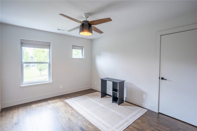 808 S Locust Ave, Fayetteville, AR 72701 - unfurnished bedroom with wood finished floors and ceiling fan