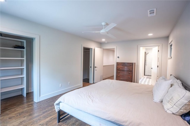 808 S Locust Ave, Fayetteville, AR 72701 - bedroom with a spacious closet, dark wood-style flooring, recessed lighting, a closet, and a ceiling fan