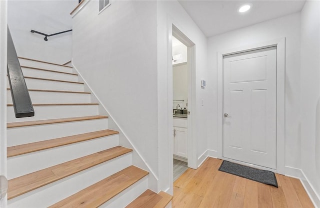 429 SW B St, Bentonville, AR 72712 - foyer entrance featuring light wood-style flooring, stairs, recessed lighting, and baseboards