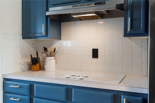 13004 Canehill Rd, Lincoln, AR 72744 - kitchen featuring blue cabinets, under cabinet range hood, light countertops, backsplash, and white electric stovetop