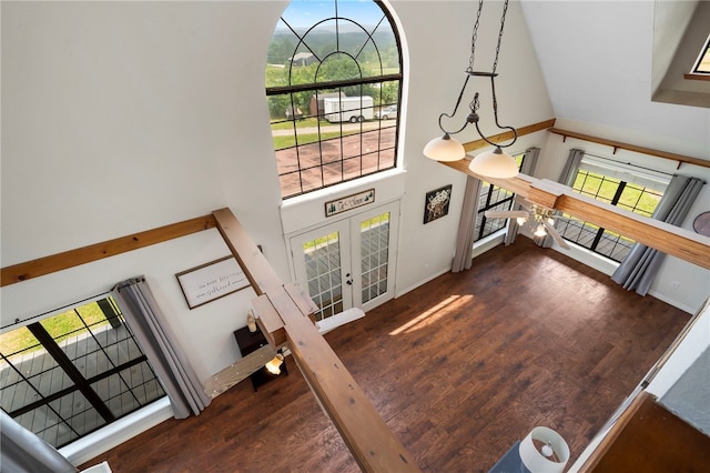 13004 Canehill Rd, Lincoln, AR 72744 - living room featuring a high ceiling, french doors, wood finished floors, and baseboards