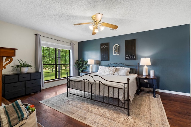 13004 Canehill Rd, Lincoln, AR 72744 - bedroom with wood finished floors, a textured ceiling, baseboards, and a ceiling fan