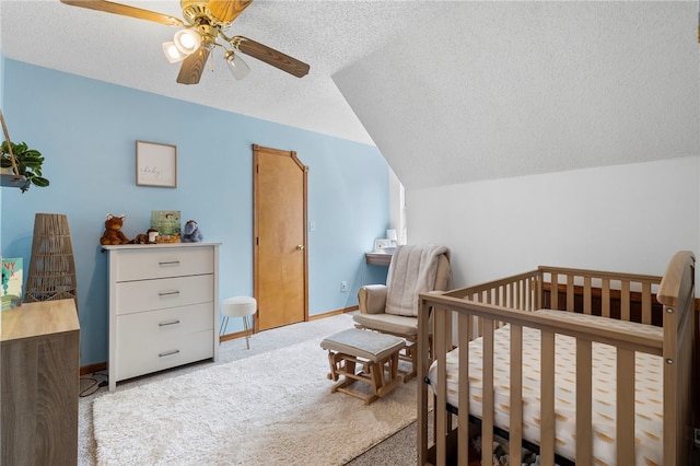 13004 Canehill Rd, Lincoln, AR 72744 - bedroom featuring a textured ceiling, carpet, lofted ceiling, baseboards, and a nursery area