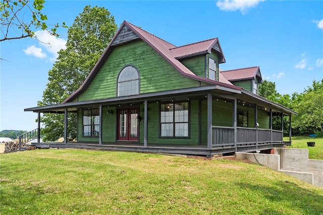 13004 Canehill Rd, Lincoln, AR 72744 - country-style home with covered porch, french doors, a front yard, and metal roof