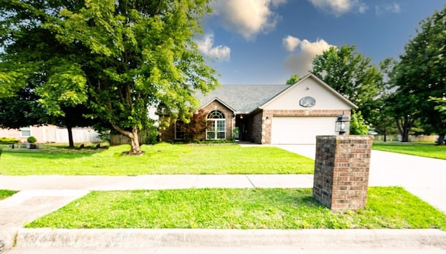 1813 SW Pine Ave, Bentonville, AR 72713 - view of front of property featuring concrete driveway, a garage, and brick siding