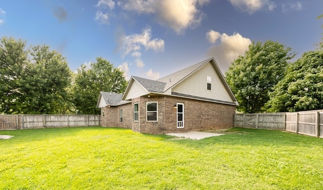1813 SW Pine Ave, Bentonville, AR 72713 - rear view of property featuring brick siding and a patio