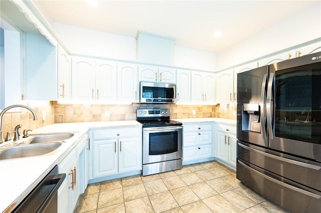 1813 SW Pine Ave, Bentonville, AR 72713 - kitchen featuring appliances with stainless steel finishes, a sink, decorative backsplash, and light countertops