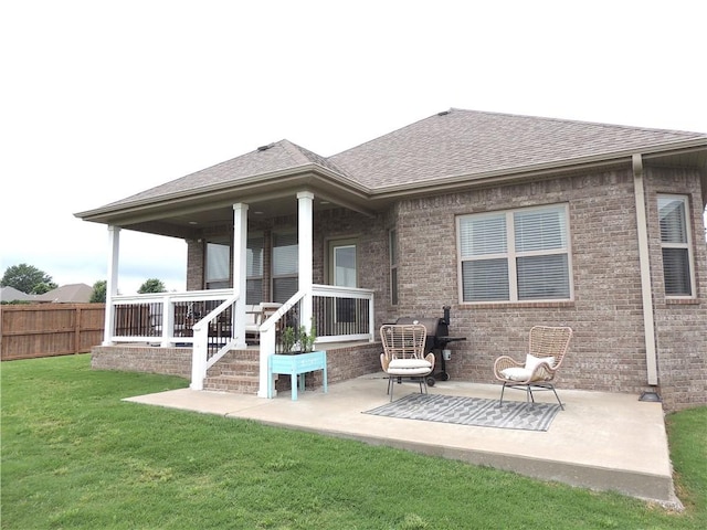 1601 Cavern Springs Way, Cave Springs, AR 72718 - back of house featuring a shingled roof, brick siding, and a patio