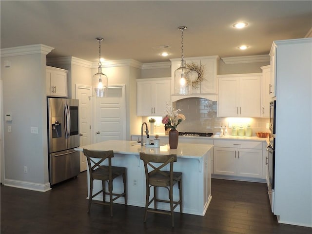 1601 Cavern Springs Way, Cave Springs, AR 72718 - kitchen featuring stainless steel refrigerator with ice dispenser, light countertops, white cabinets, tasteful backsplash, and an island with sink