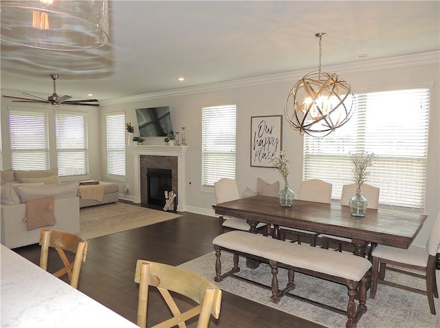 1601 Cavern Springs Way, Cave Springs, AR 72718 - dining area featuring wood finished floors, a fireplace with flush hearth, ornamental molding, a ceiling fan, and a chandelier