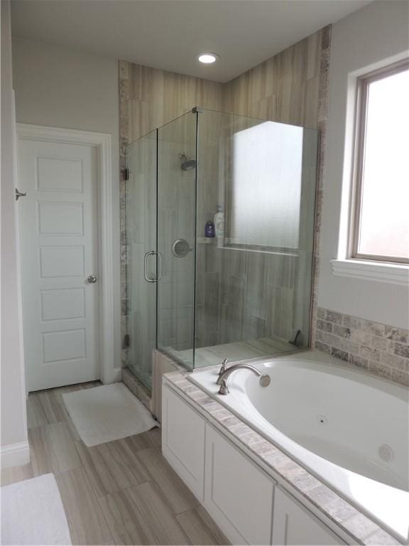 1601 Cavern Springs Way, Cave Springs, AR 72718 - full bathroom with a shower stall and a tub with jets