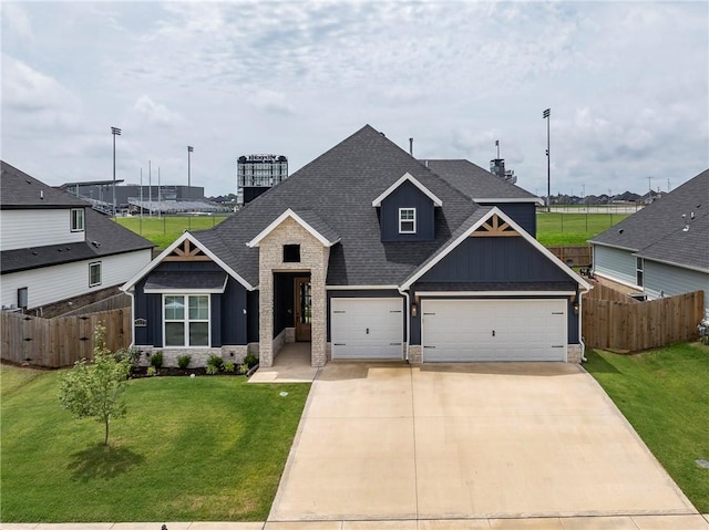 1221 Red Maple St, Centerton, AR 72719 - view of front of property with roof with shingles, board and batten siding, driveway, and stone siding