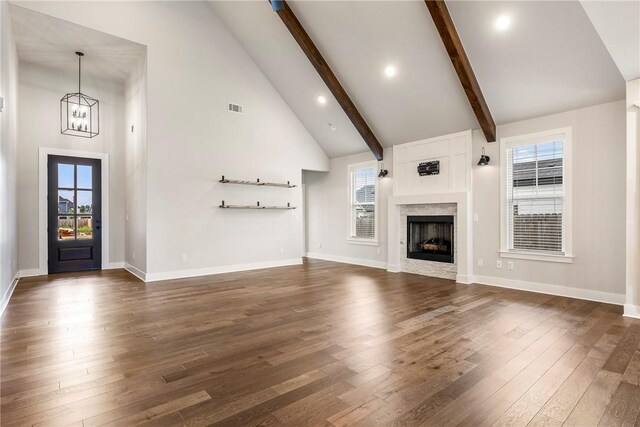 1221 Red Maple St, Centerton, AR 72719 - unfurnished living room with dark wood-style floors, high vaulted ceiling, beamed ceiling, baseboards, and a chandelier