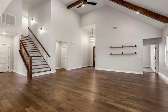 1221 Red Maple St, Centerton, AR 72719 - unfurnished living room featuring ceiling fan, high vaulted ceiling, stairs, dark wood-type flooring, and beam ceiling