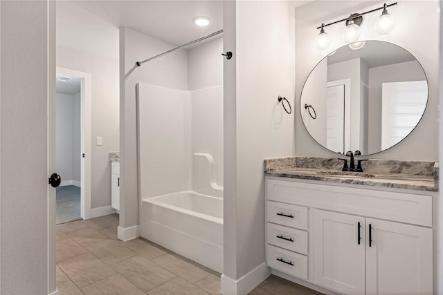1221 Red Maple St, Centerton, AR 72719 - bathroom with vanity, tub / shower combination, and baseboards