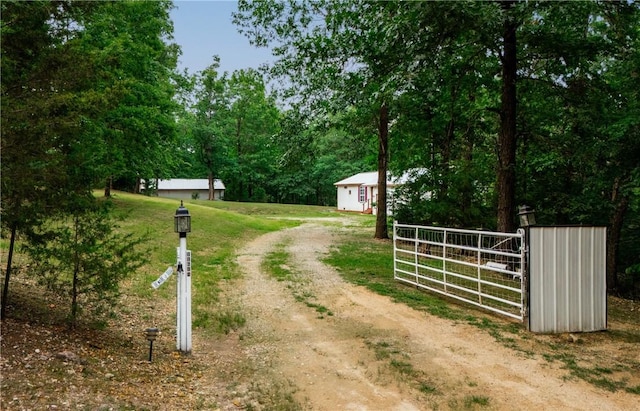 11648 Ventris Rd, Garfield, AR 72732 - view of dirt / gravel driveway featuring a gate and a gated entry