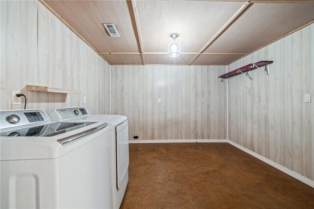 11648 Ventris Rd, Garfield, AR 72732 - laundry area with separate washer and dryer, wooden walls, and baseboards