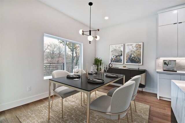 1 Breeghle Ln, Bella Vista, AR 72714 - dining room with wood finished floors, a chandelier, and recessed lighting