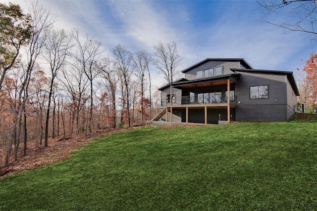 1 Breeghle Ln, Bella Vista, AR 72714 - rear view of house featuring a yard, stairway, and a wooden deck