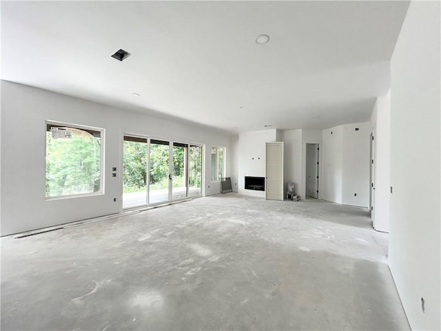 1 Breeghle Ln, Bella Vista, AR 72714 - unfurnished living room featuring concrete flooring
