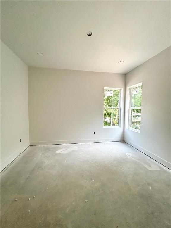 1 Breeghle Ln, Bella Vista, AR 72714 - spare room featuring concrete floors and baseboards