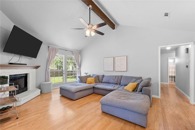 704 Del Cir, Lowell, AR 72745 - living area featuring ceiling fan, light wood-style flooring, a fireplace, and baseboards