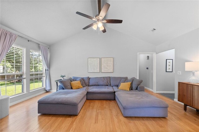 704 Del Cir, Lowell, AR 72745 - living area with light wood-style floors, ceiling fan, baseboards, and high vaulted ceiling